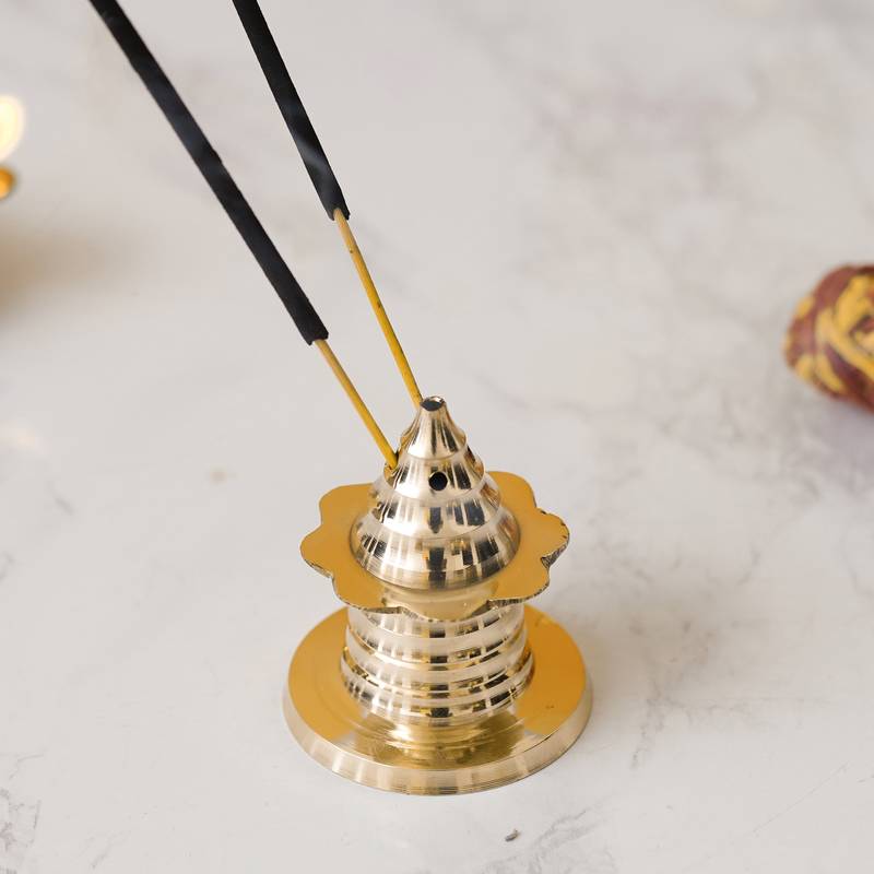 One traditional golden brass incense stick holder agarbatti stand