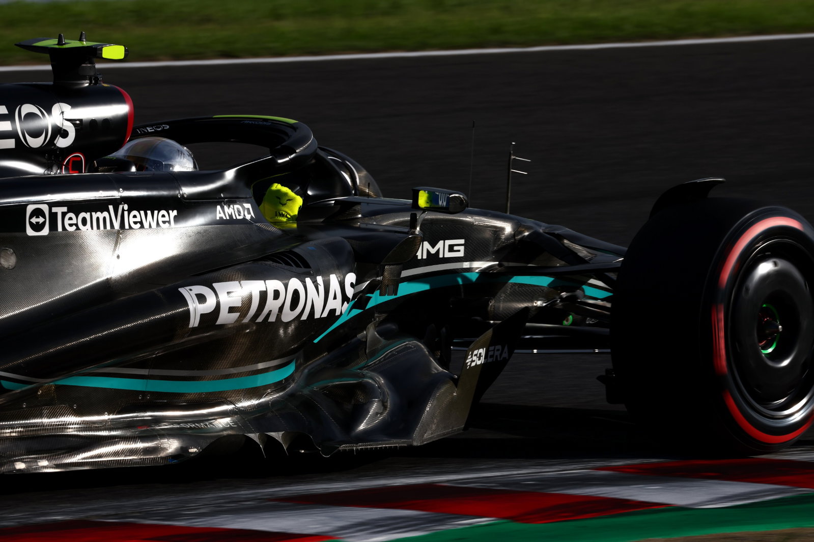 Lewis Hamilton picks up damage after first-lap Sergio Perez clash