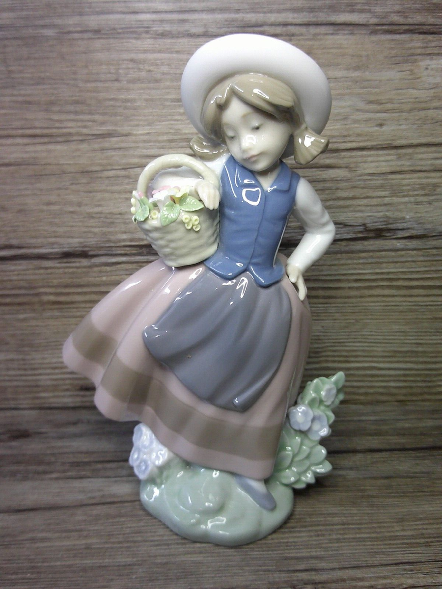 Lladro figure of little girl w/ basket of flowers sweet scent No