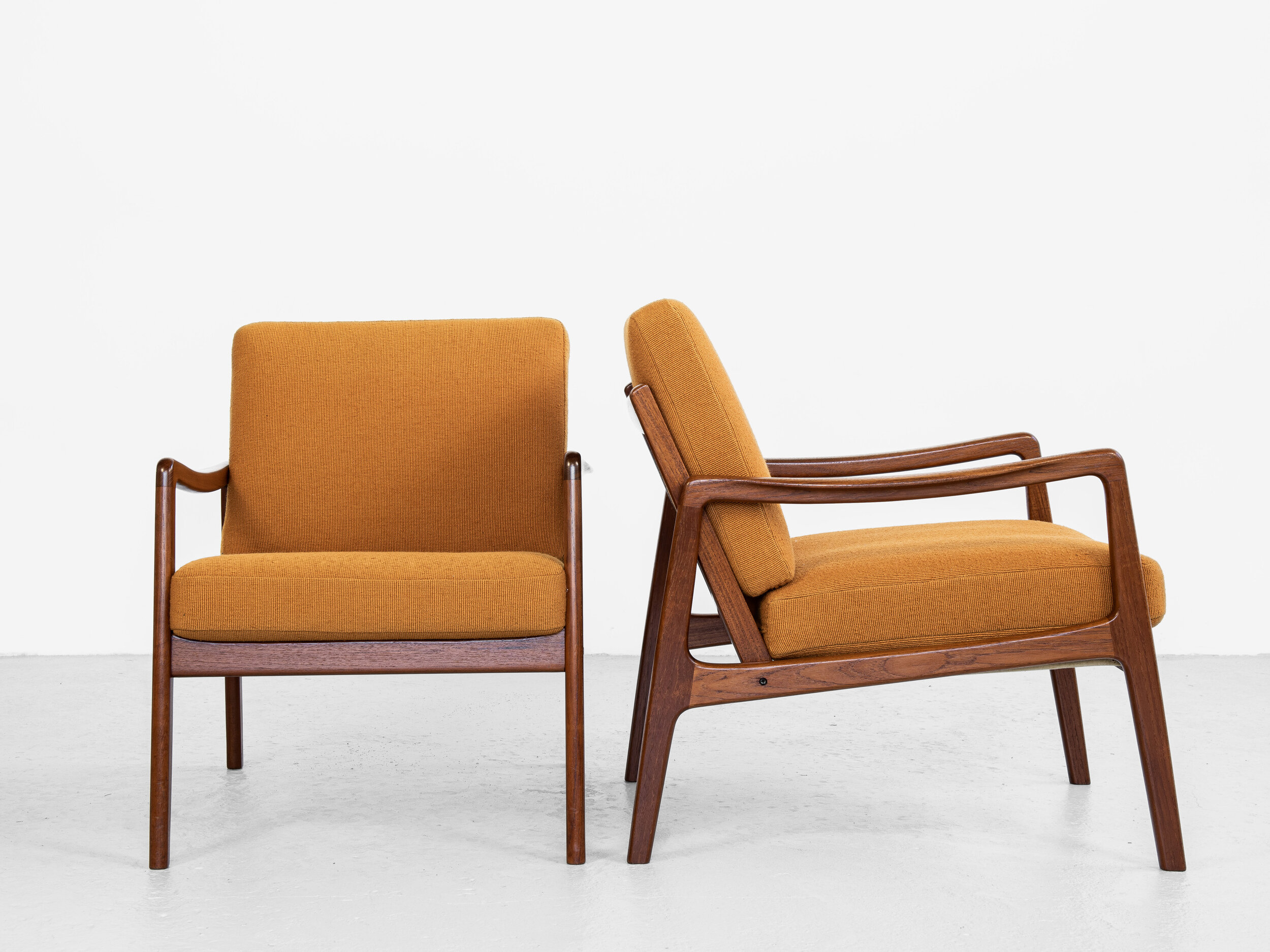 Midcentury Danish pair of easy chairs in teak by Ole Wanscher for