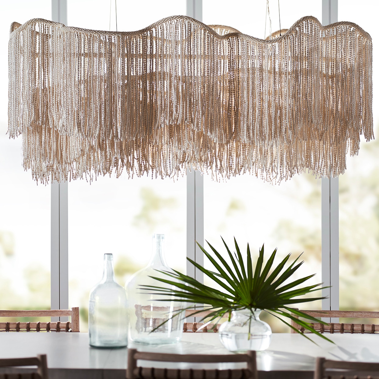 Strands of tiny wood beads in a cream finish embellished with