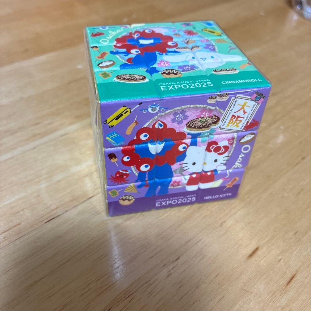 万博 サンリオ ミャクミャク キティ ルービックキューブ パズル - メルカリ