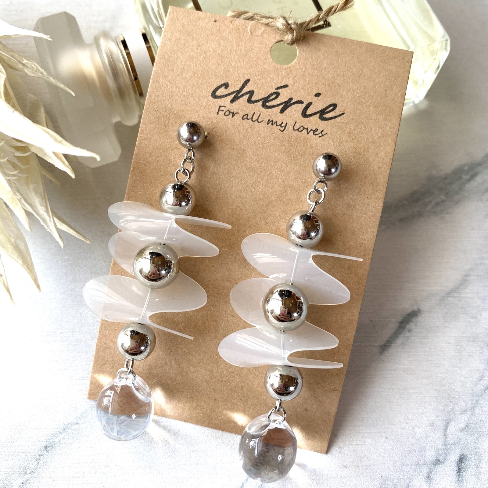 silver×PVC クリアドロップピアス/イヤリング ミルク - chérie